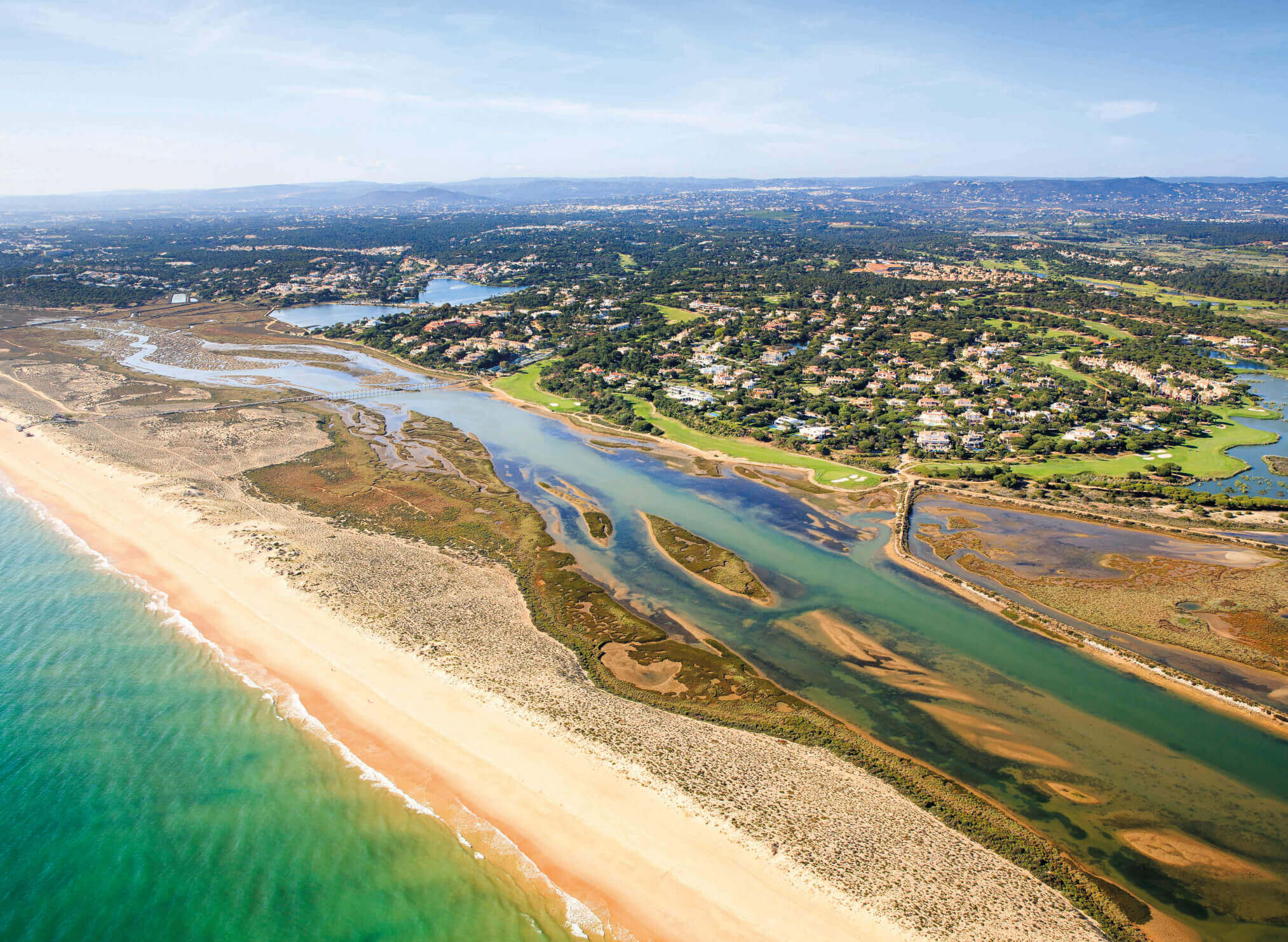 Aerial view over Quinta do Lago resort, showing premium properties, pine trees and waterways