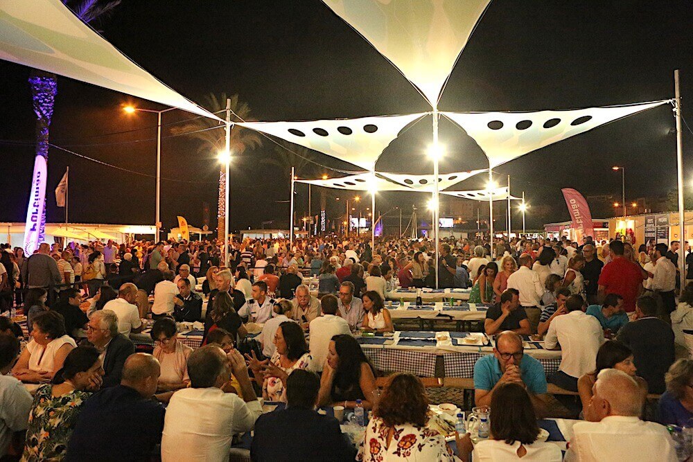 Vibrant atmosphere at the annual Portimão Sardine Festival alongside the Arade River waterfront